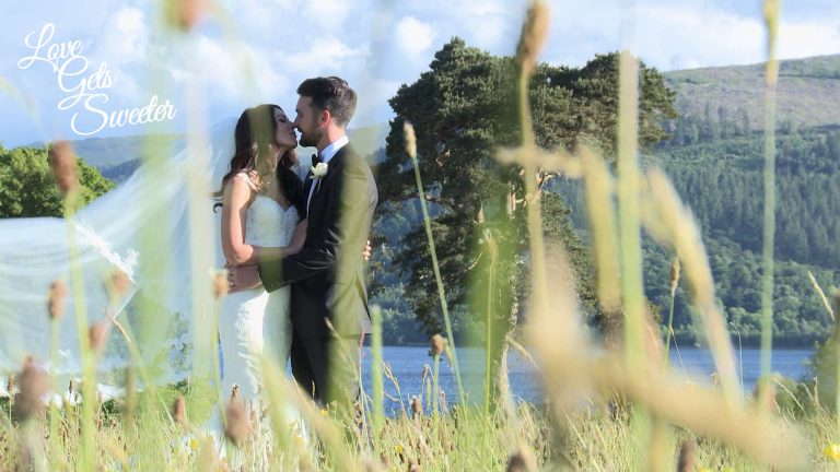 couple in long grass at Armathwaite Hall in the lakes