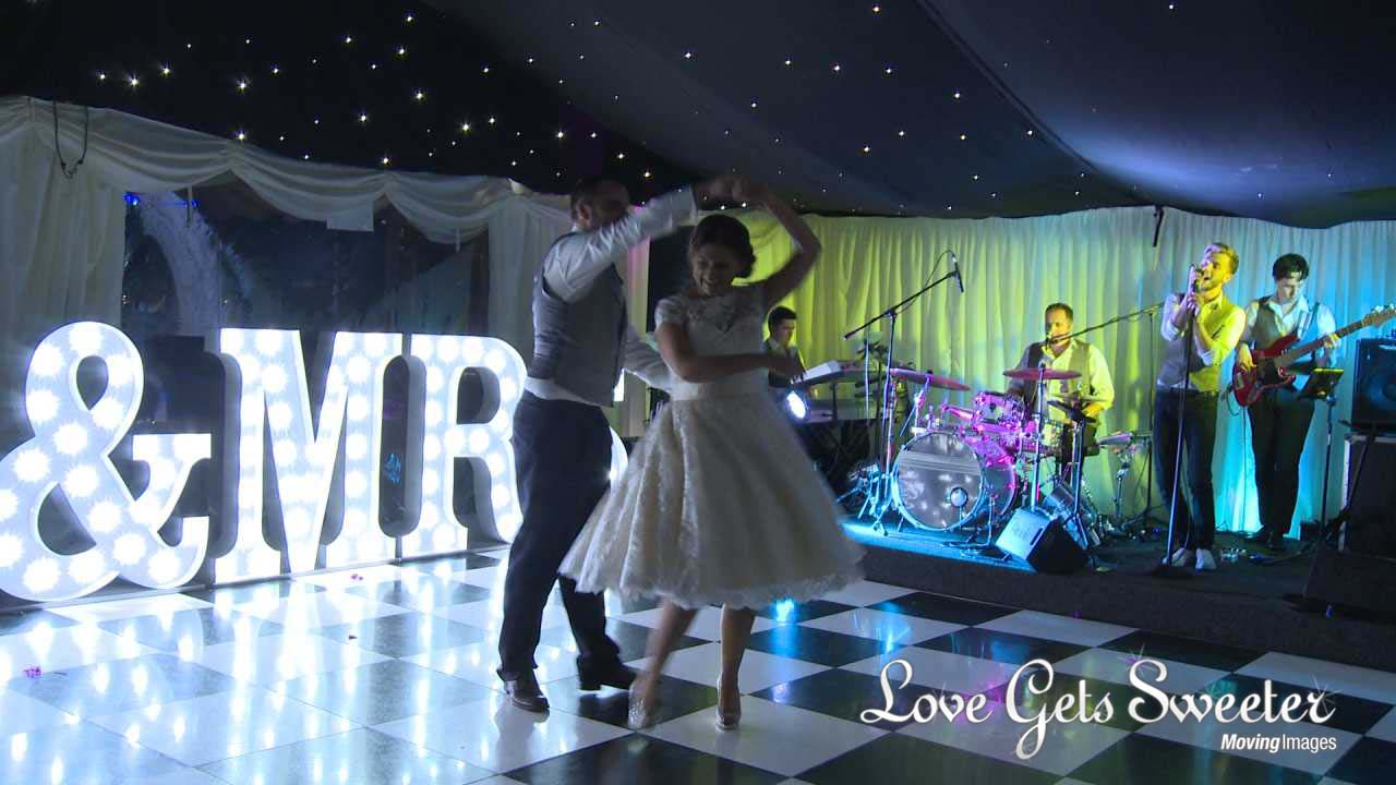 first dance at Soughton Hall in front of Mr and Mrs light up letters