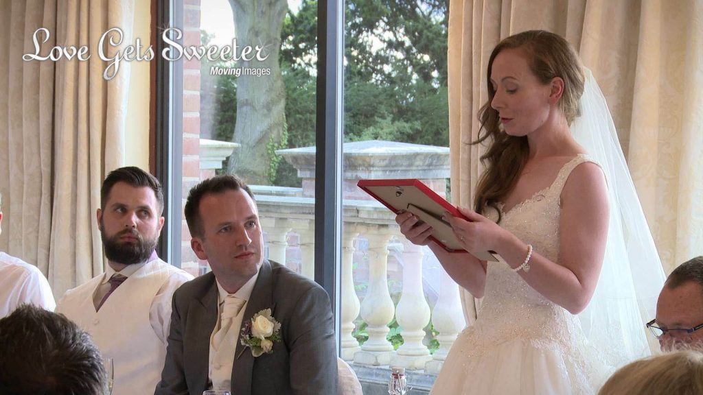 bride surprising her groom with a speech and special Manchester United signed wedding gift