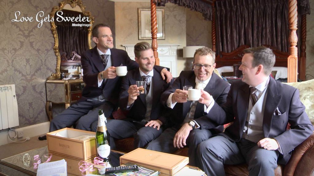 groom and groomsmen drinking champagne out of tea cups at Eaves Hall