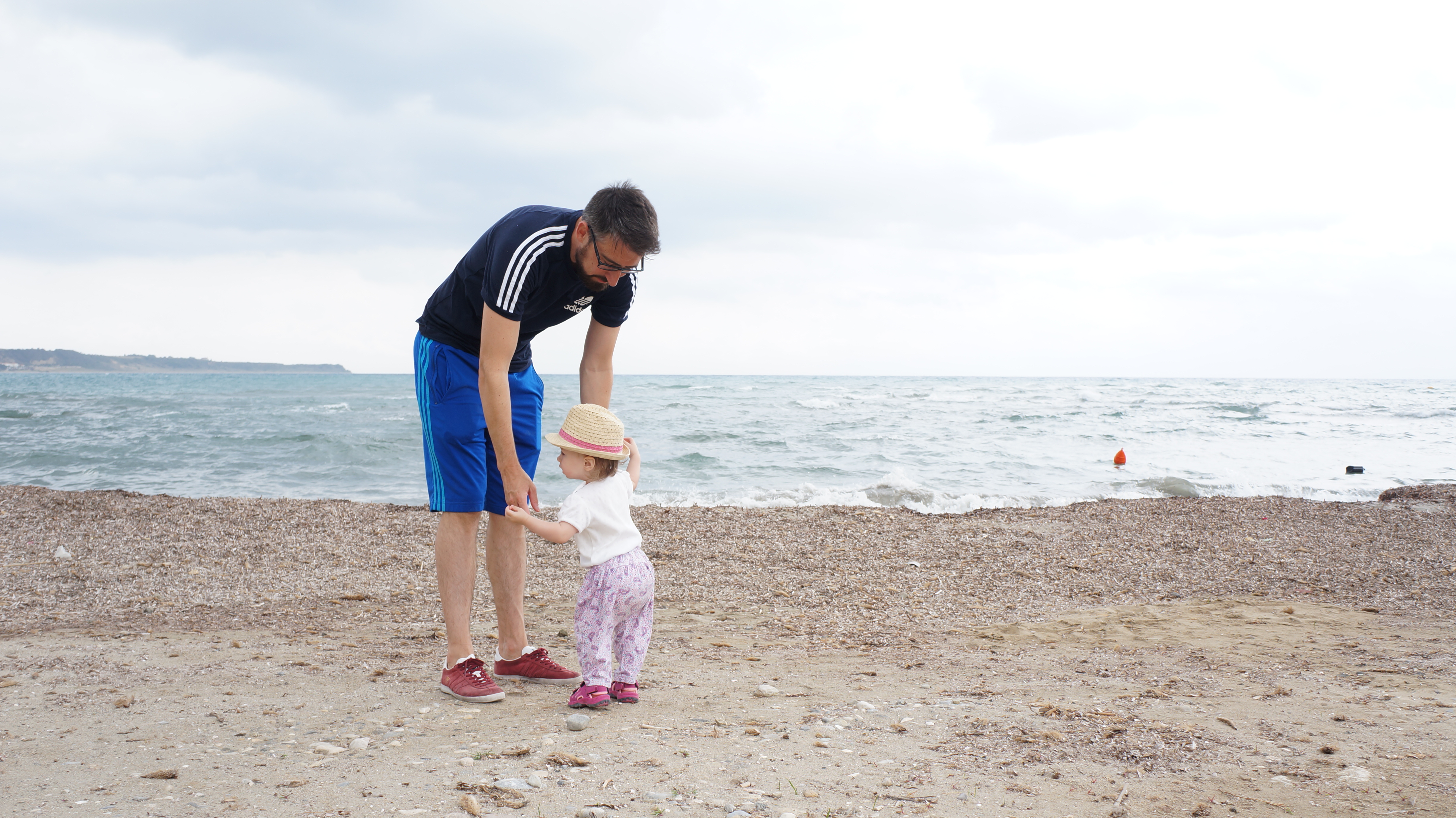 daddy on the beach with daughter