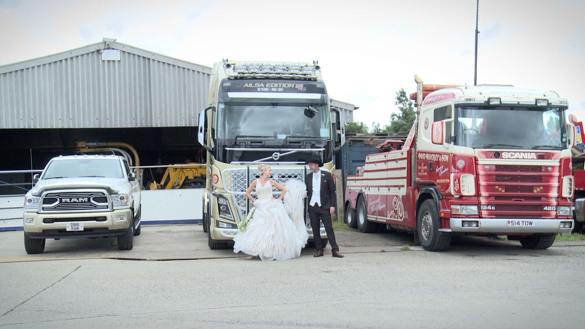 bride and groom posing for the wedding photographer in front of the custom paint gold blockley and sons truck in drighlington