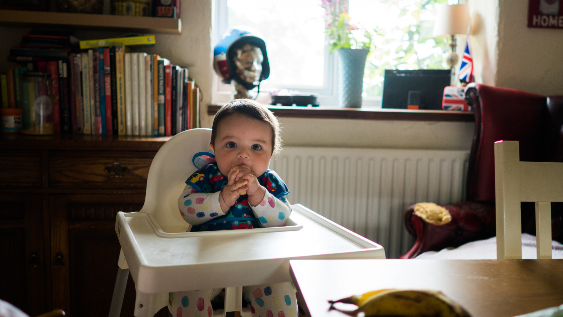 a little boy tried baby led weaning in his Ikea highchair in Lancashire