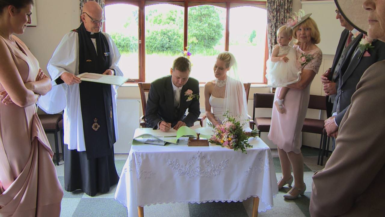 the signing of the register inside St Marks Church in Cheshire