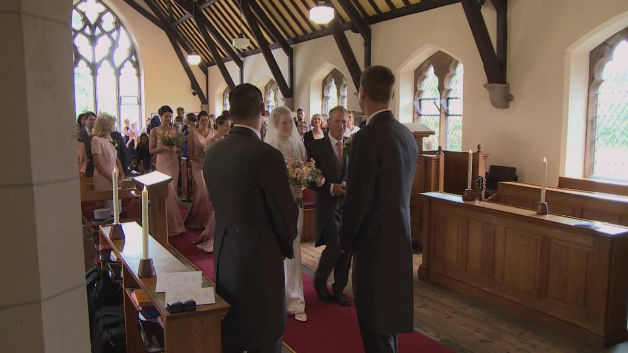 a still from the wedding video of a wedding ceremony at St Marks Church