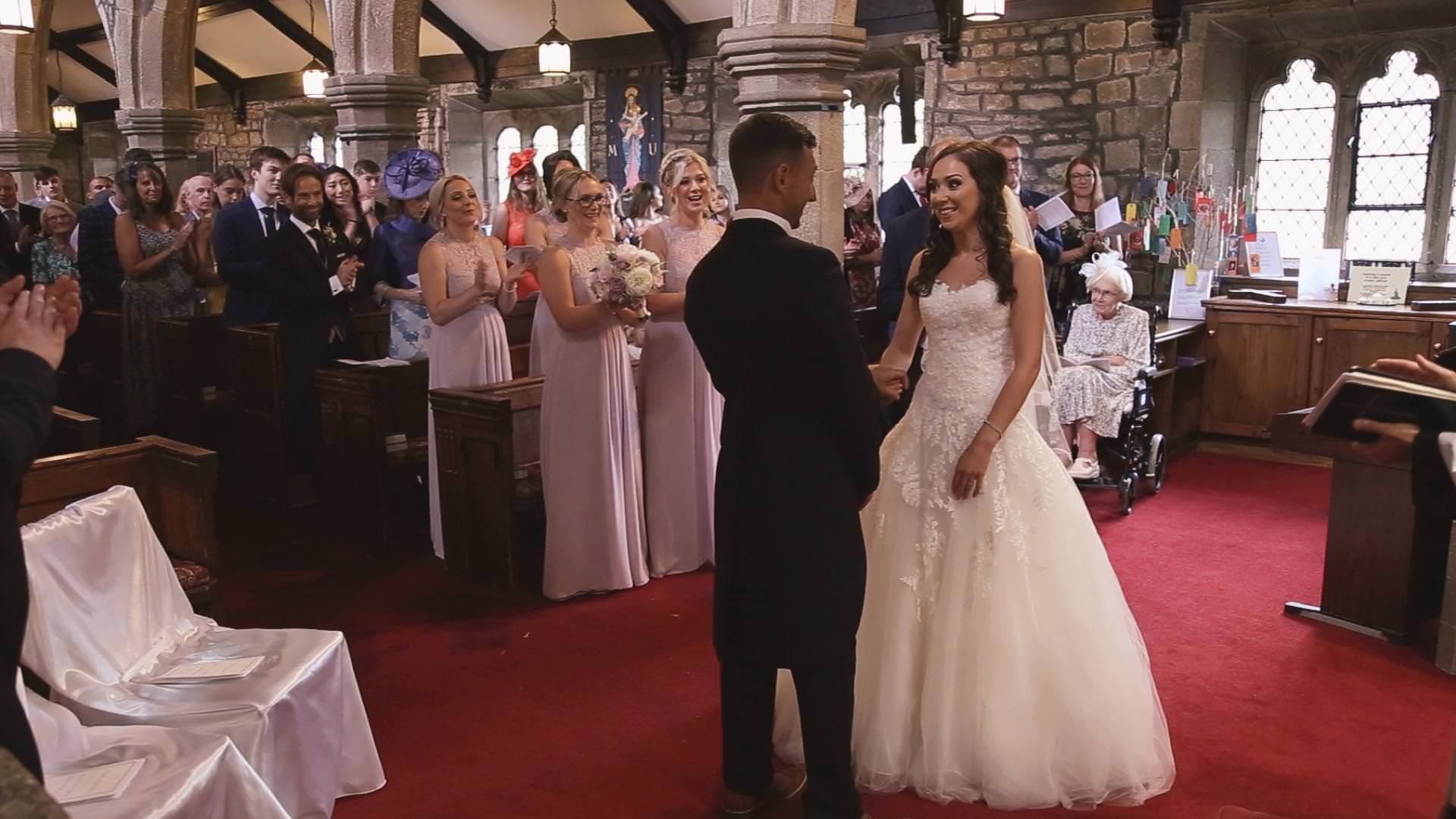a wide video still of a bride and groom getting married at St Bartholomews and St John’s Church in Lancashire