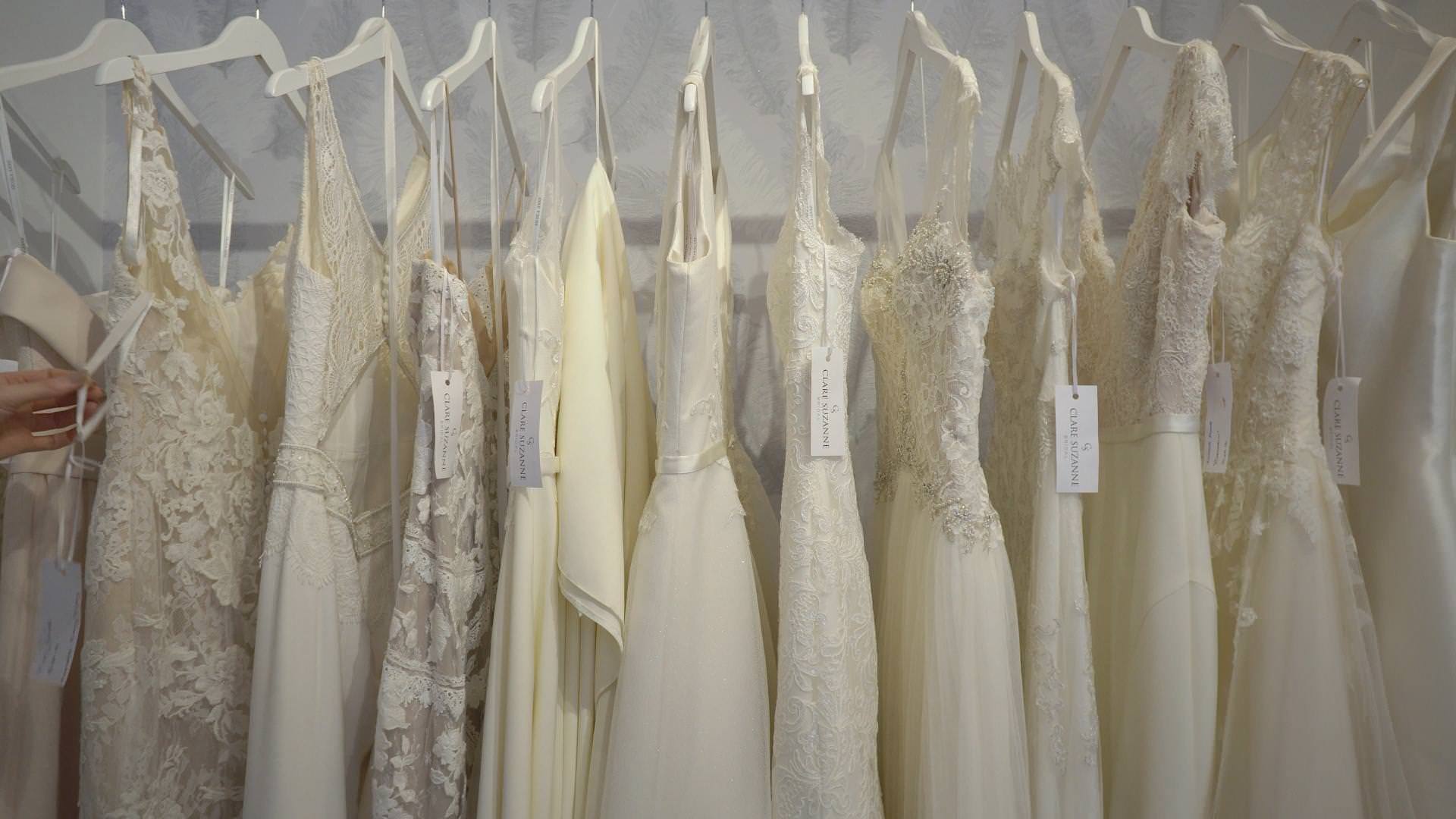 a wide shot of a row of wedding dresses in liverpool shop