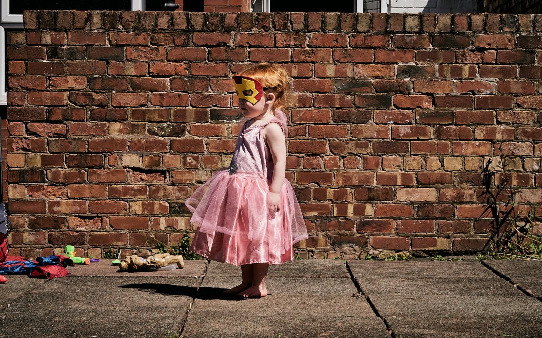 fun photo of little girl as a fairy superhero