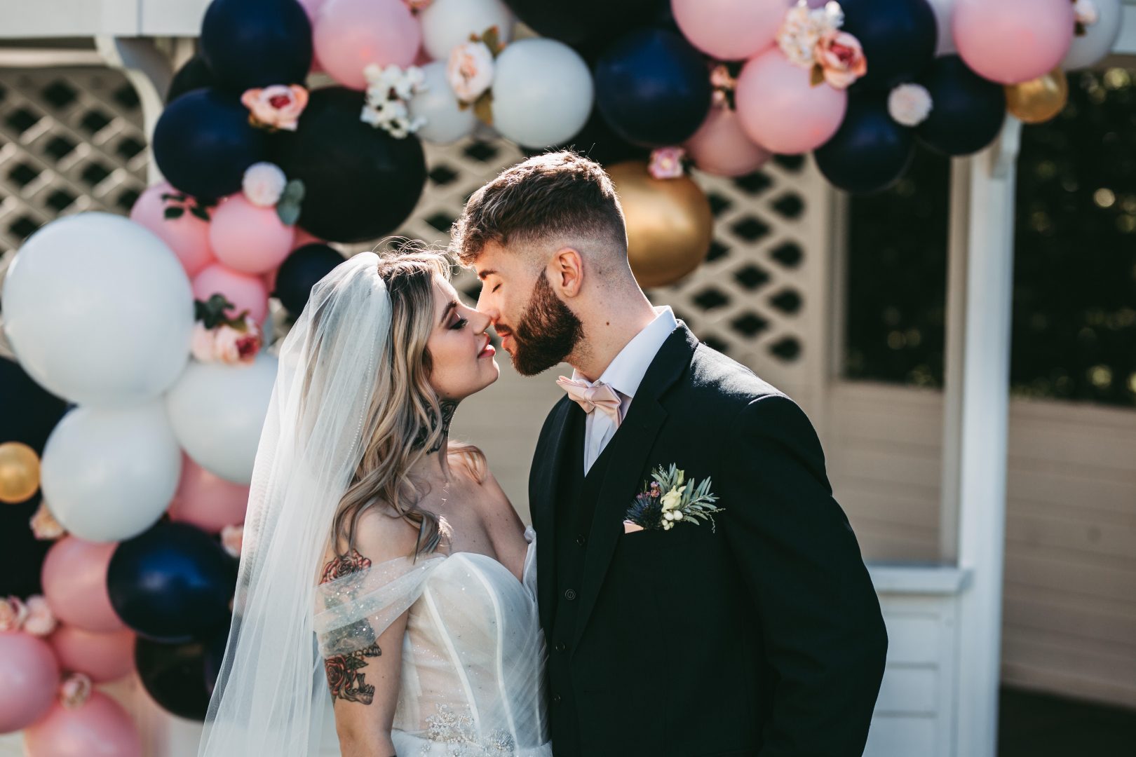 west tower outdoor wedding with balloon arch