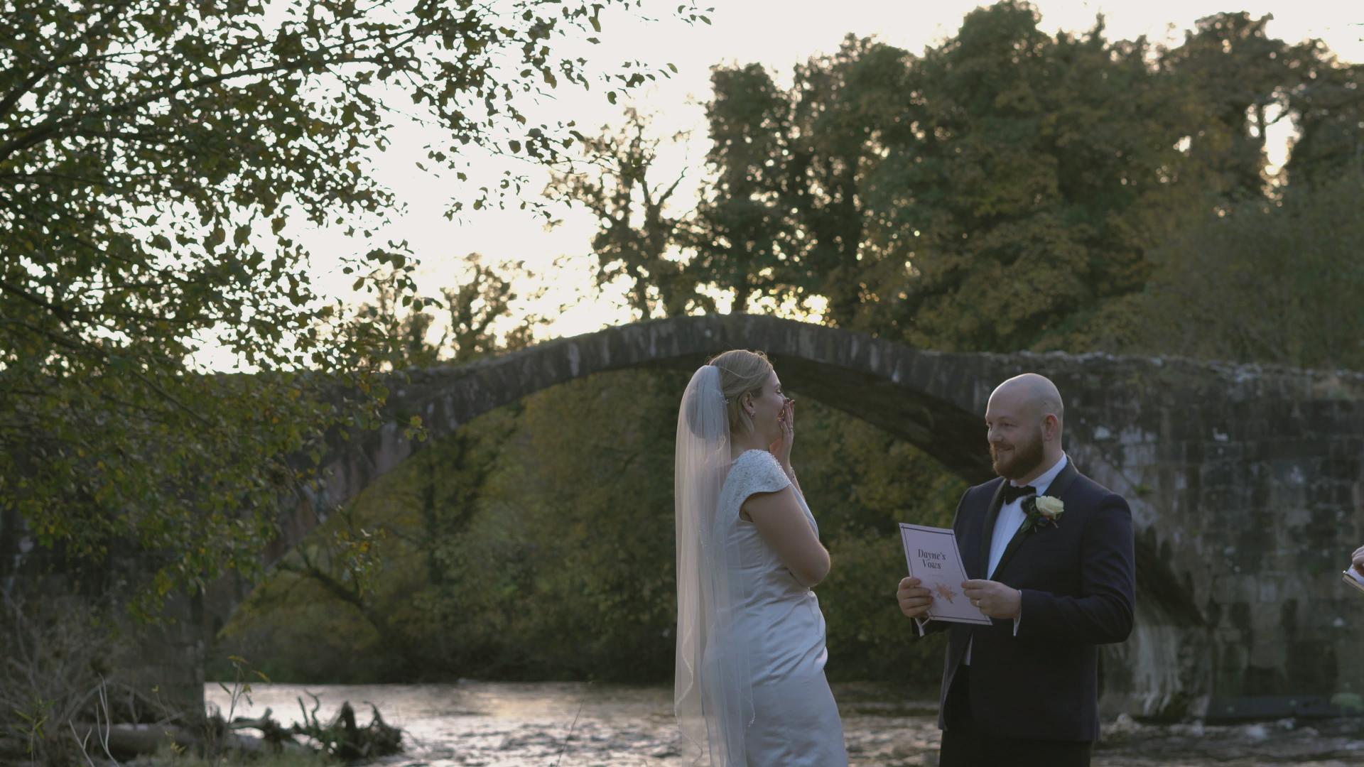 couple laugh as they say their vows during elopement