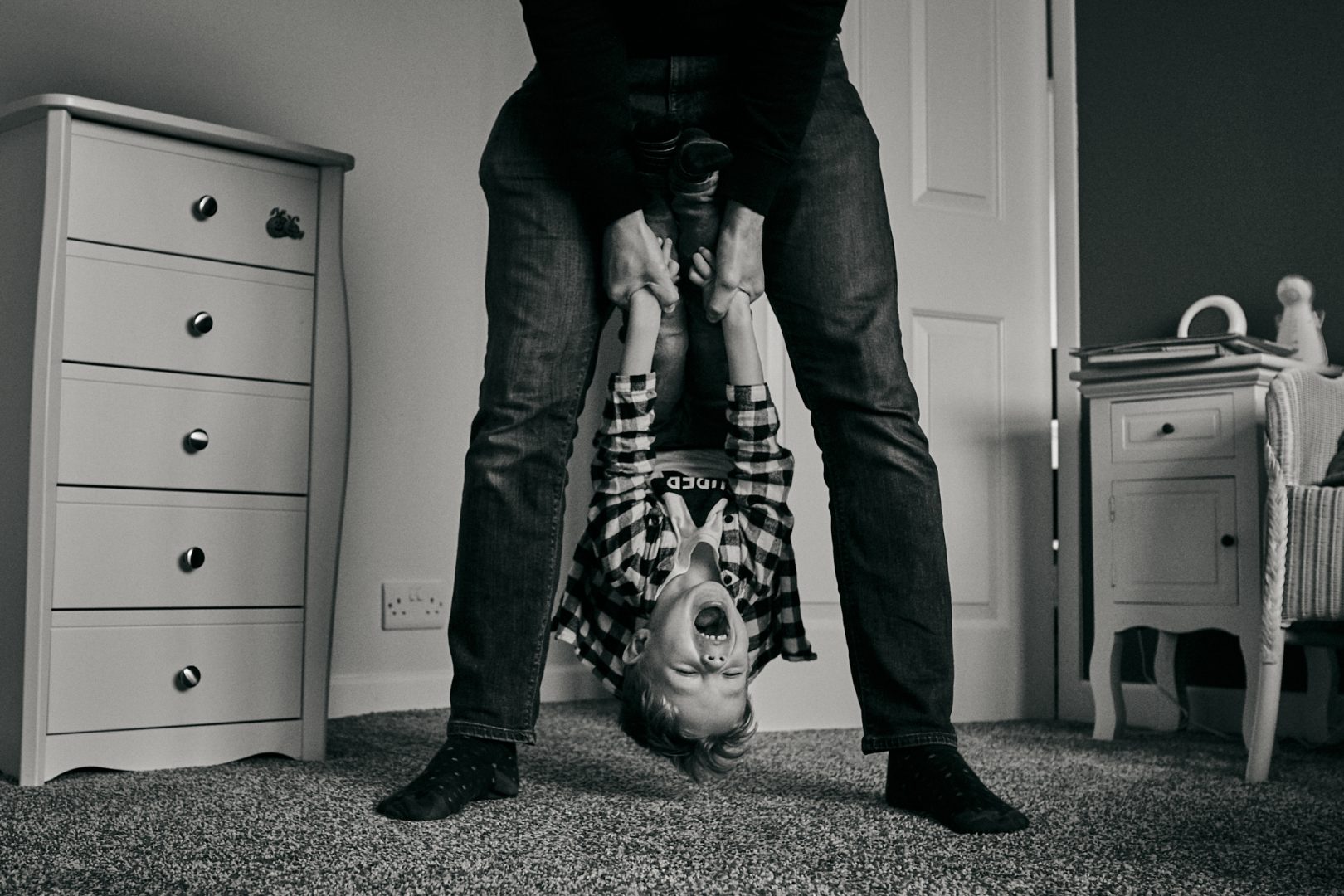 natural family photography cheshire dad swinging child