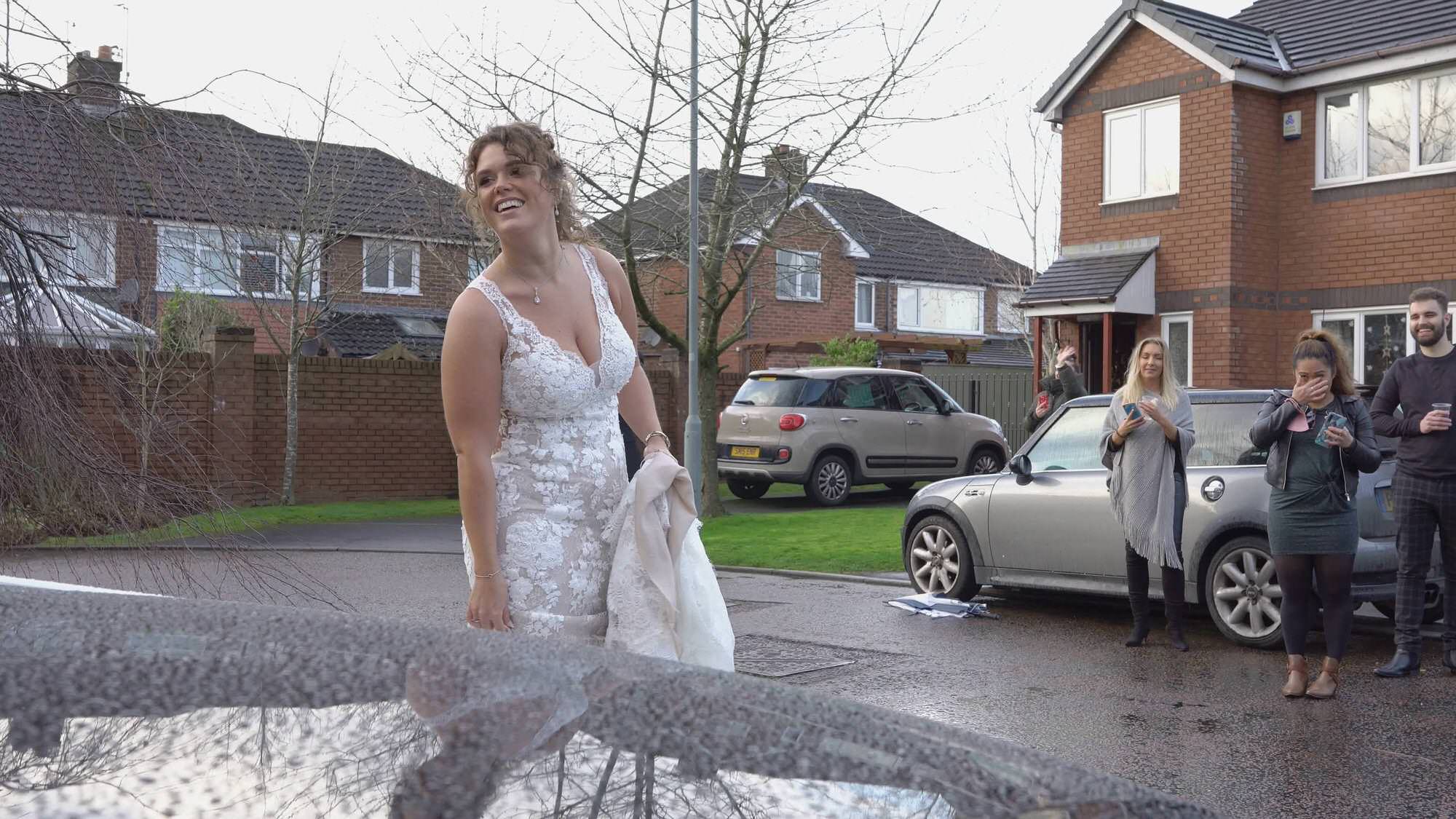covid bride laughs distanced from neighbours in preston