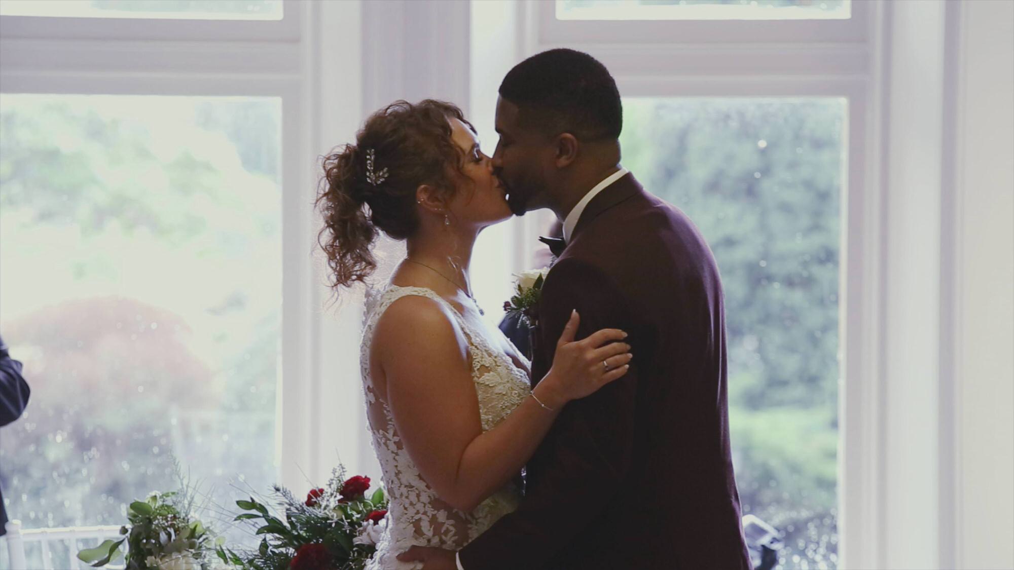 couple kiss on wedding video at Preston Micro wedding