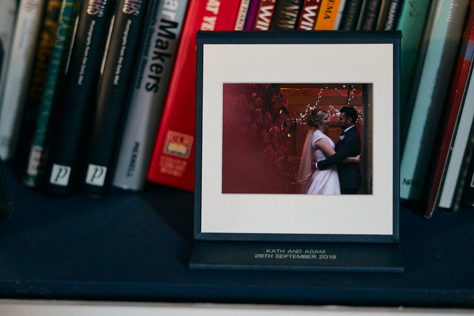 wedding USB case and film books on shelf