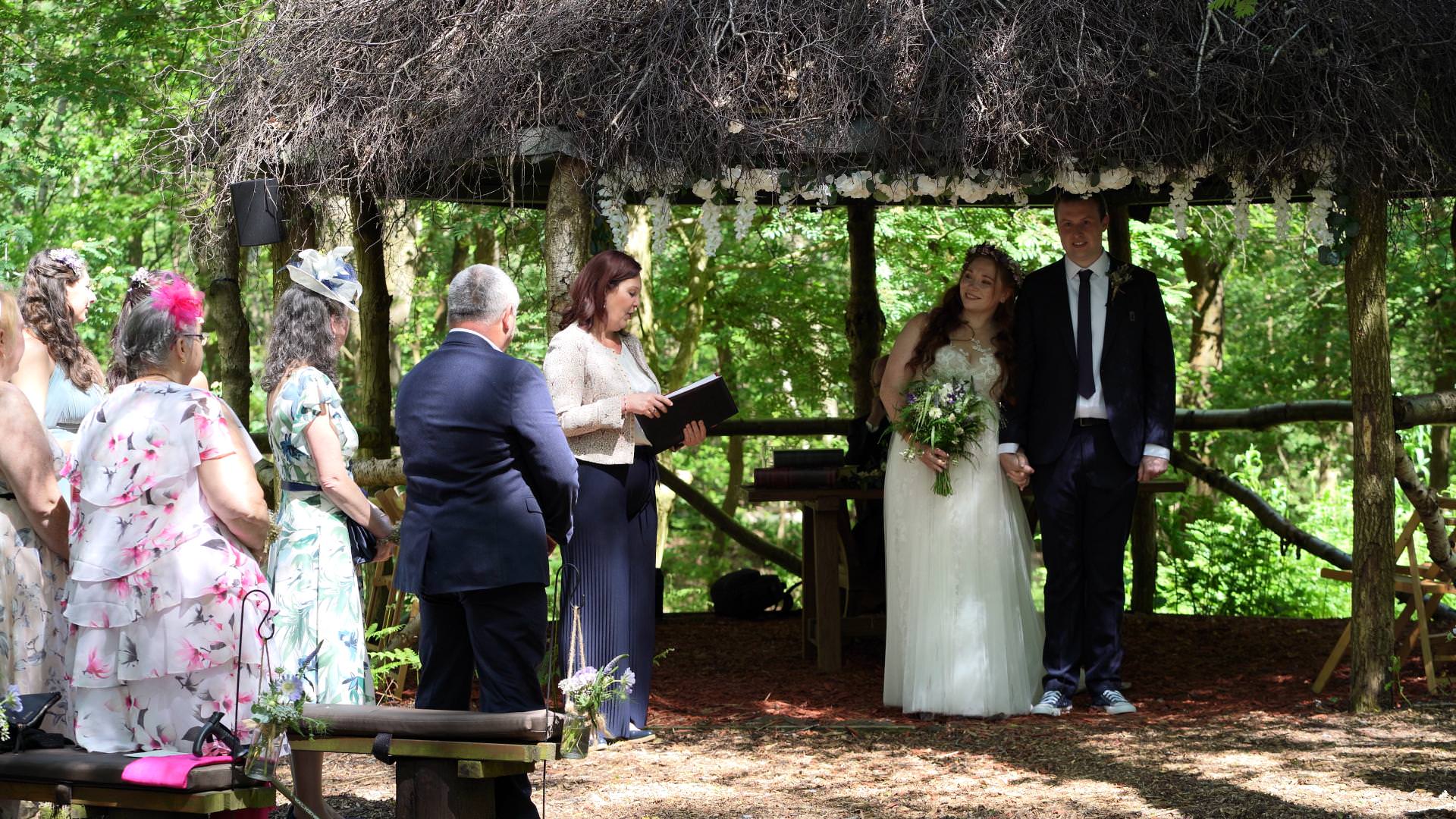 wedding videographer at outdoor cheshire woodland wedding ceremony