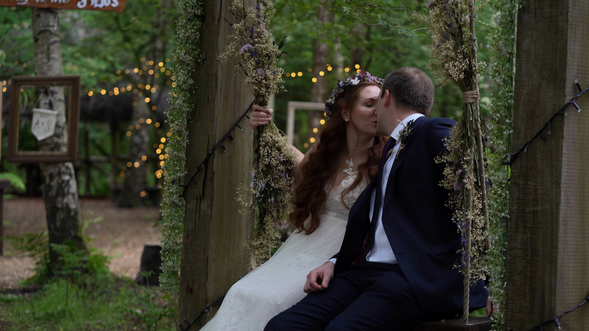 video of couple kiss on swing at Cheshire Woodland weddings
