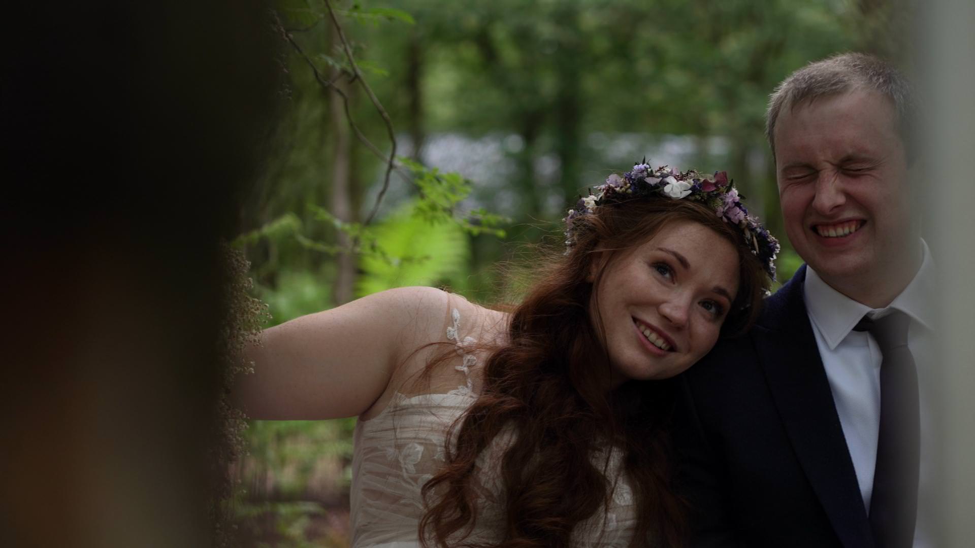 couple pose for wedding photographer in woodlands in cheshire
