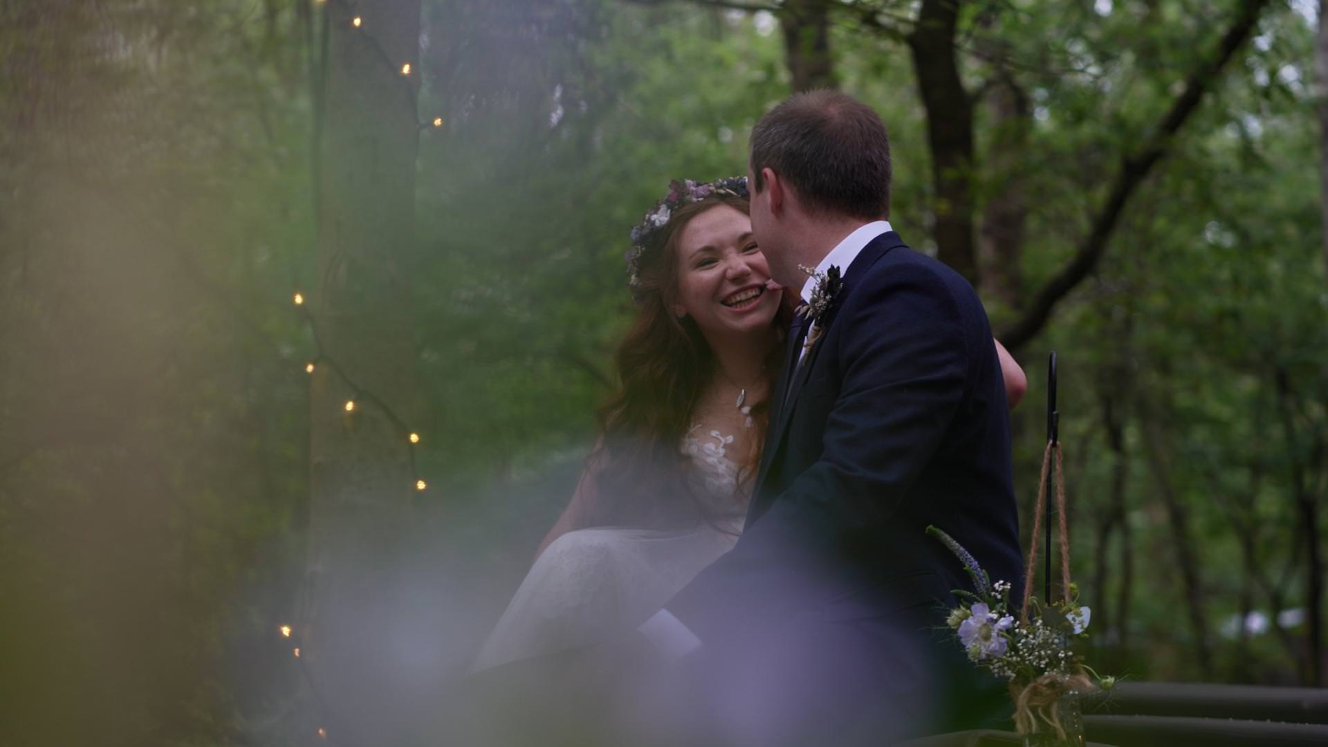 videographer captures natural moment with couple at Cheshire Woodland Weddings