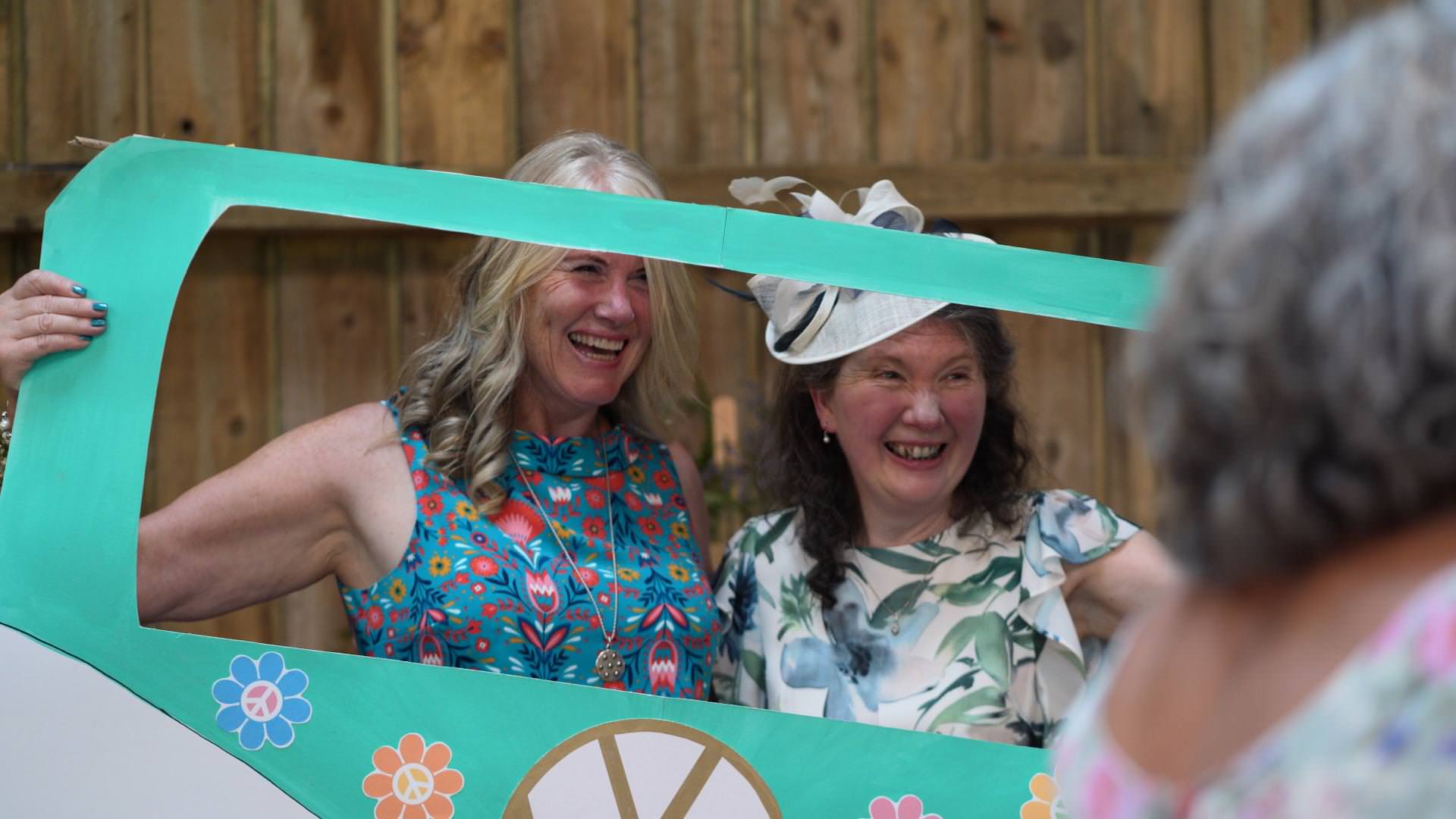 guests laughing with camper van photobooth