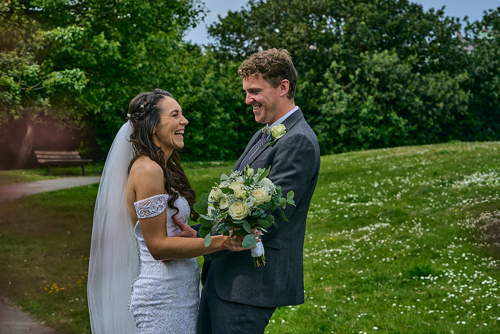 couple laugh for wedding photographer in Adelaide gardens Crosby