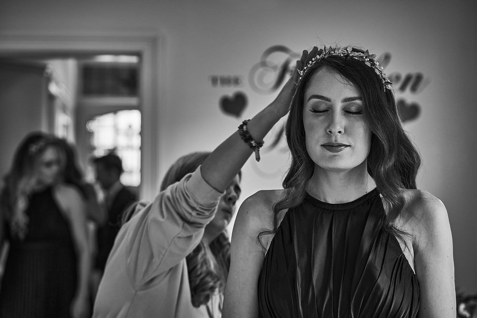 bridesmaid closes her eyes during busy wedding prep