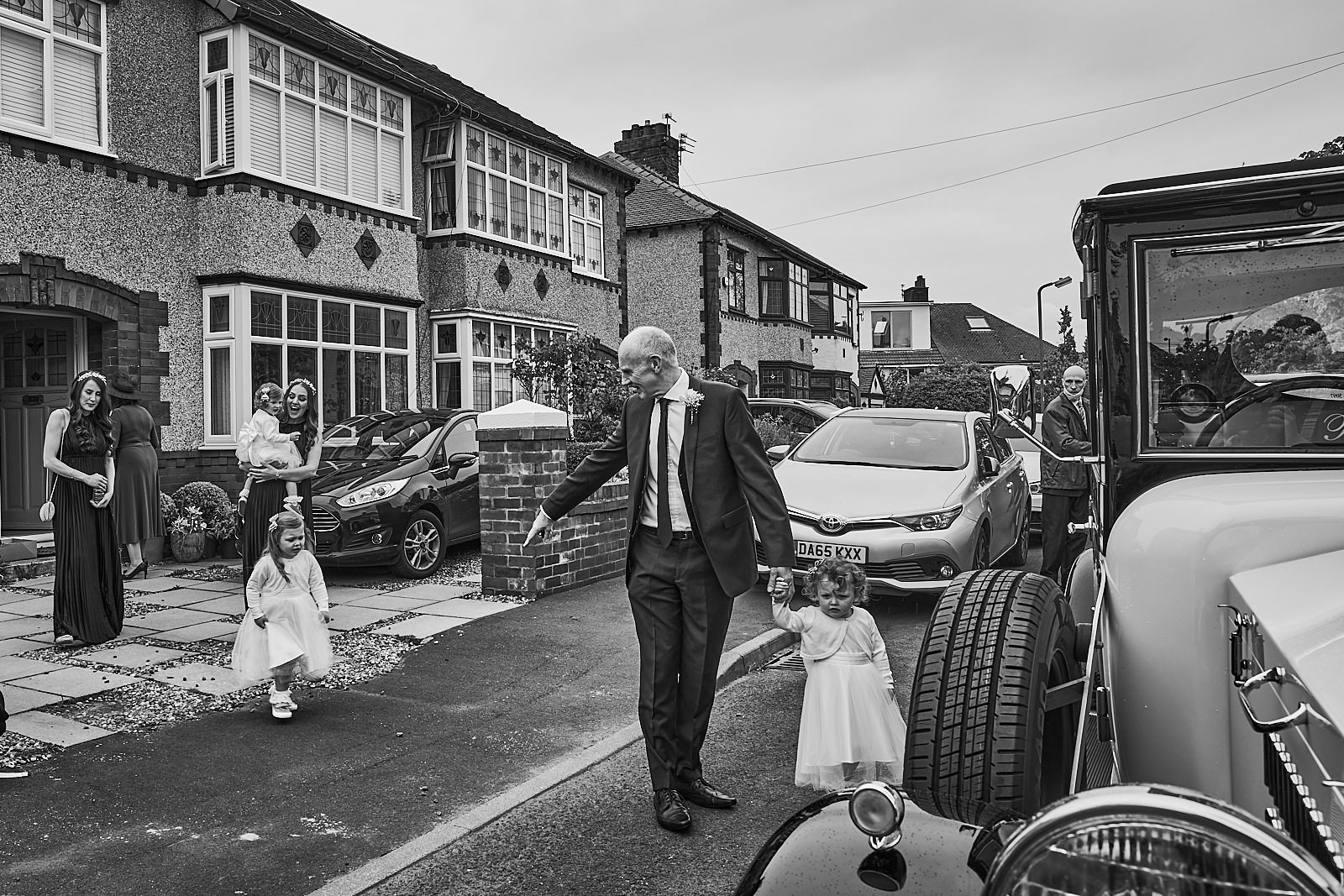 documentary photo of bridal party leaving Crosby for wedding ceremony