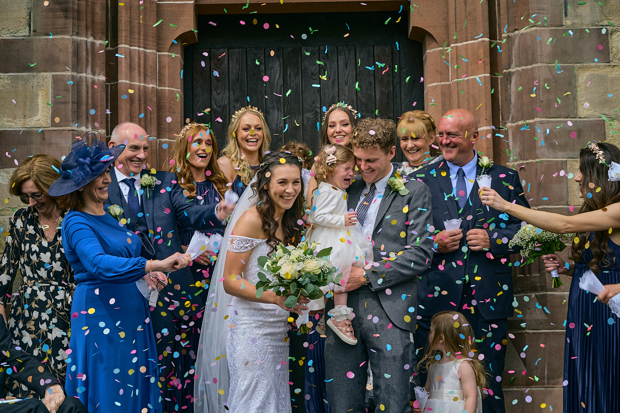 fun confetti wedding photo outside liverpool church