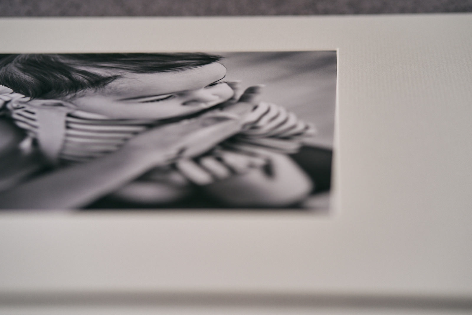 Close up of a fine art mounted photo print of a baby