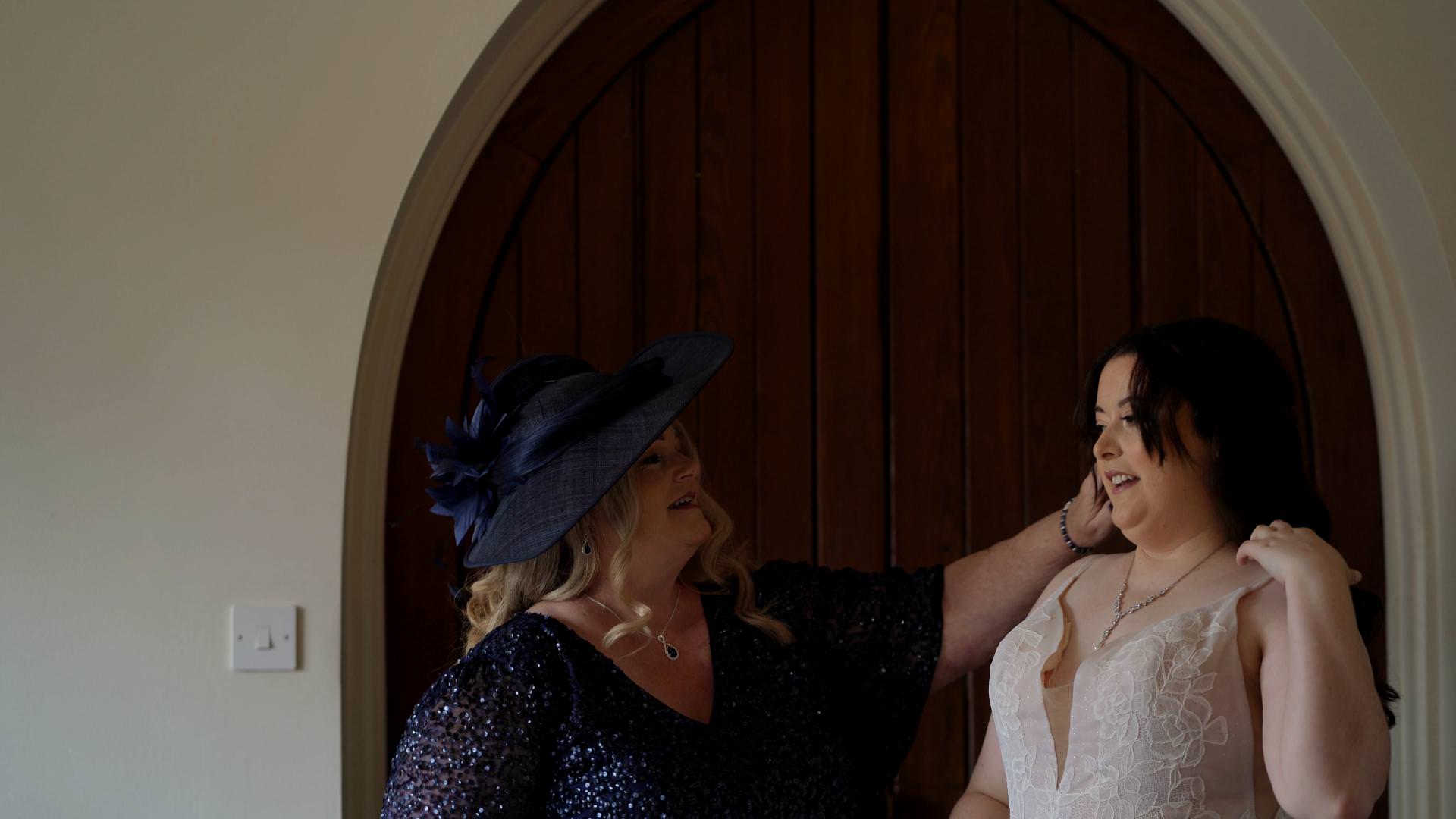 brides mum helps with finishing touches at Combermere Abbey