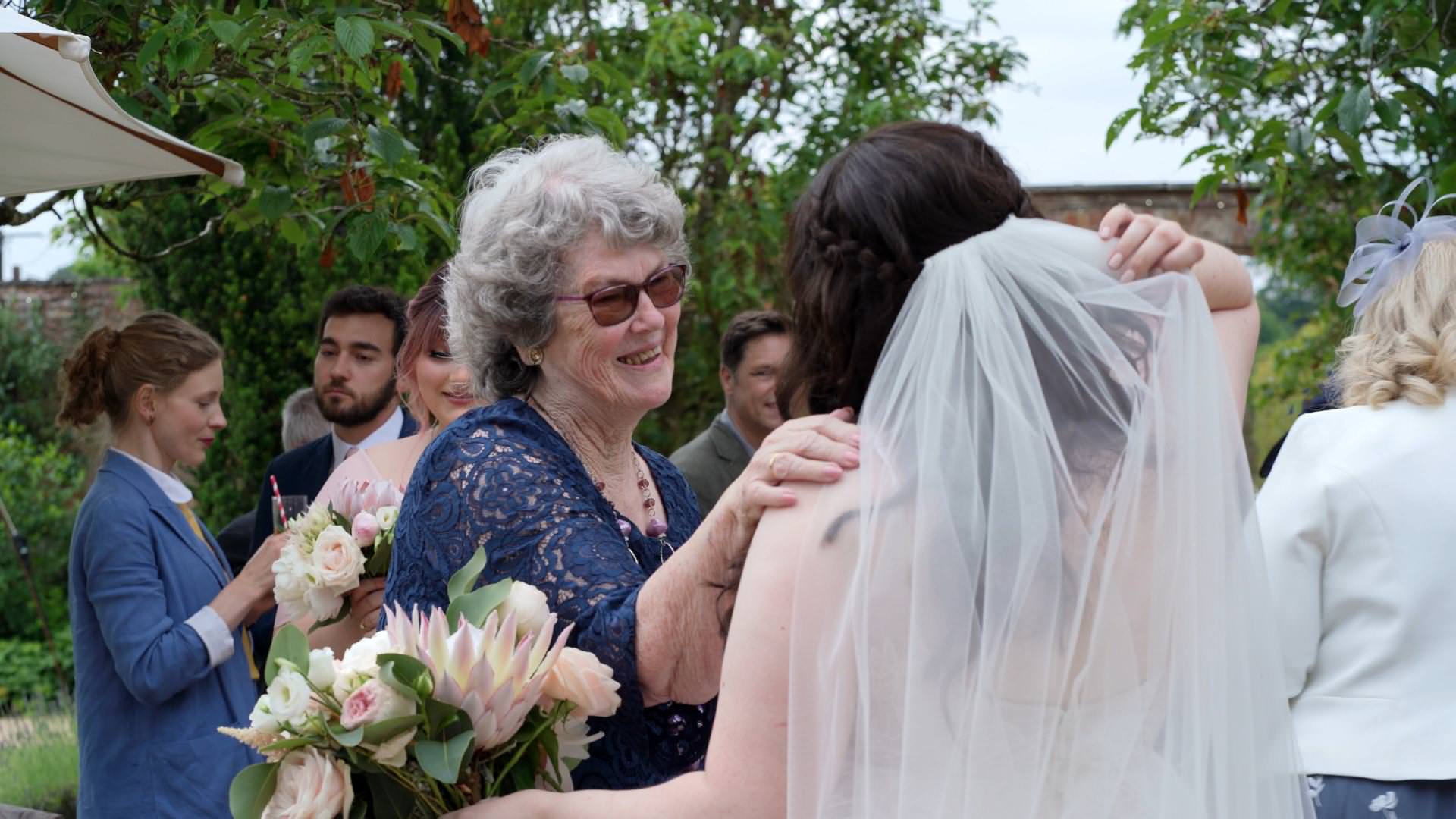 candid moment of grandma with bride