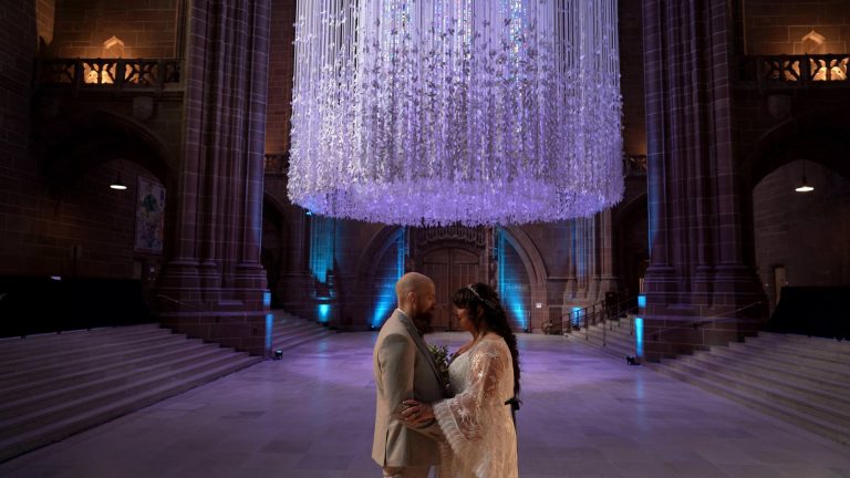 Couple under Peace Doves Liverpool after wedding