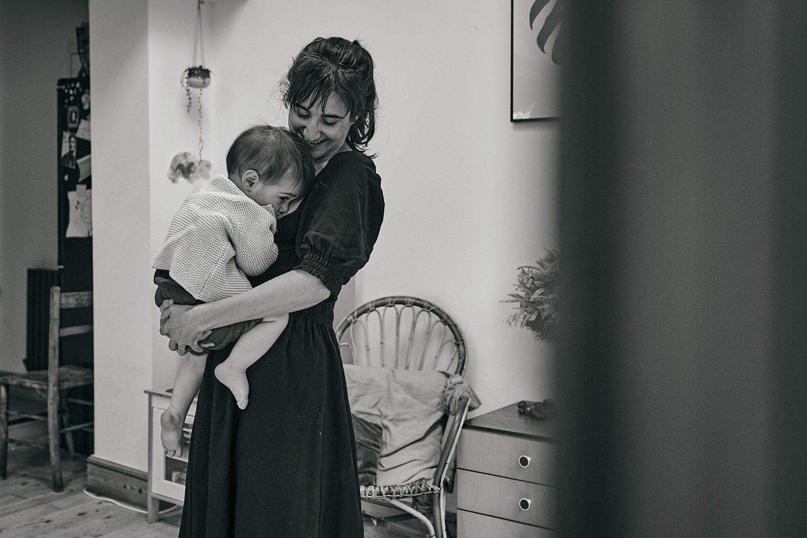 mum standing up whilst breastfeeding photograph