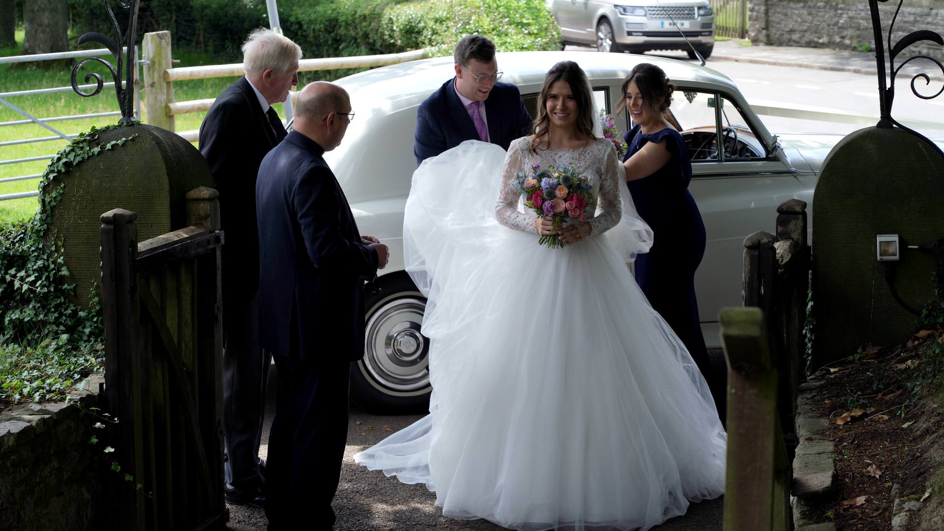 bride smiles outside Osmaston Church