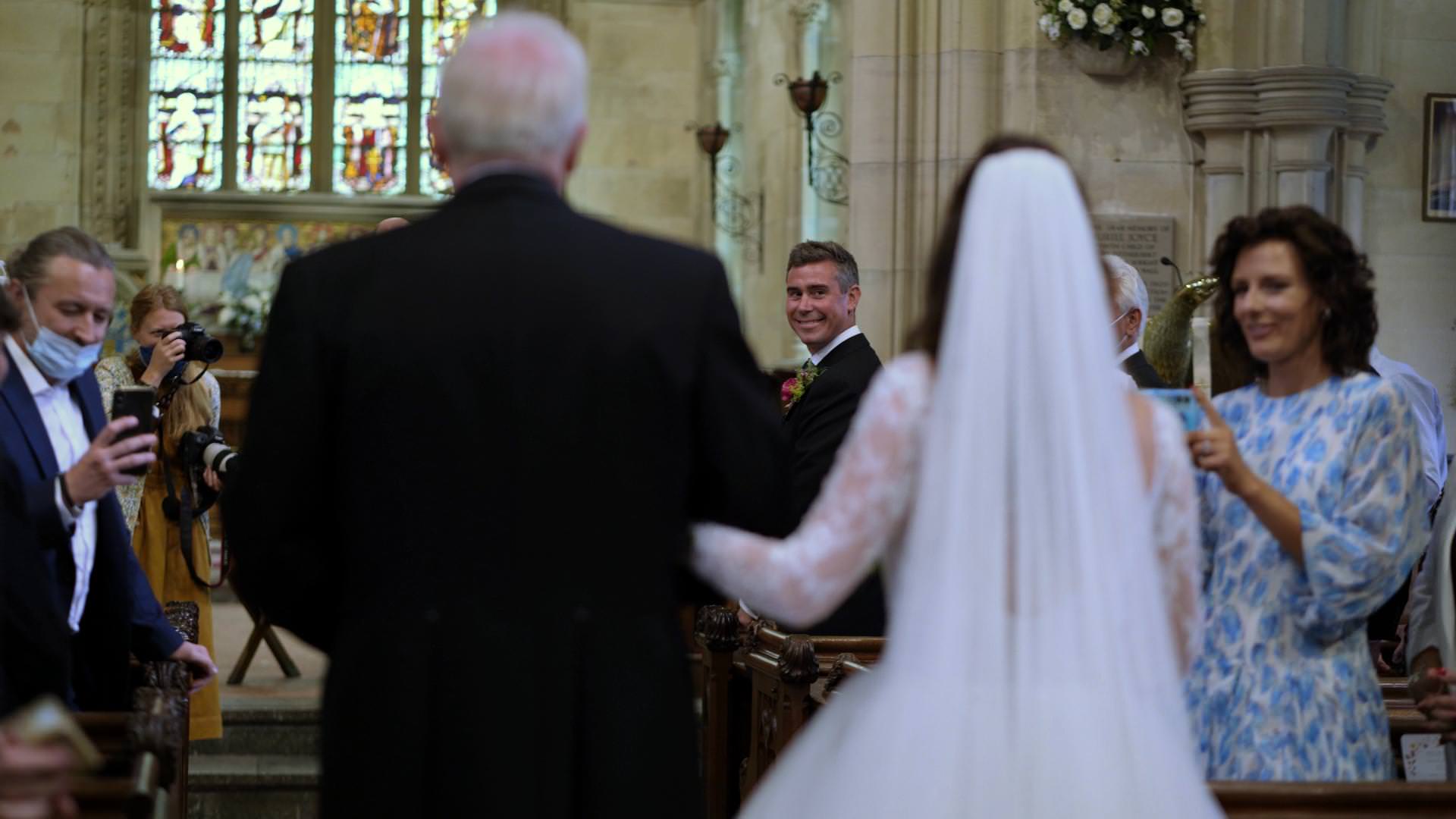 videographer captures groom first look at church