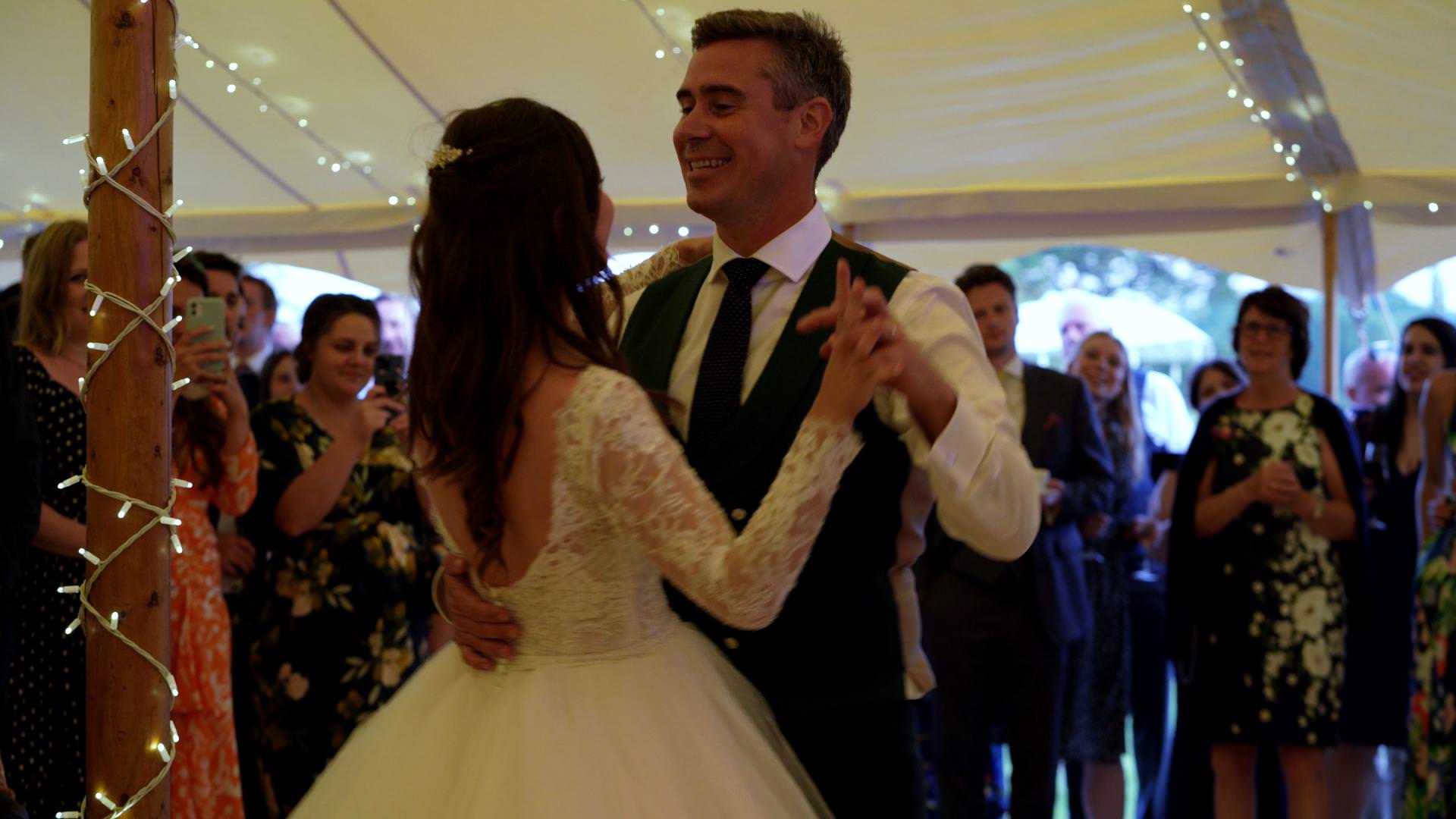bride and grooms first dance inside tipi