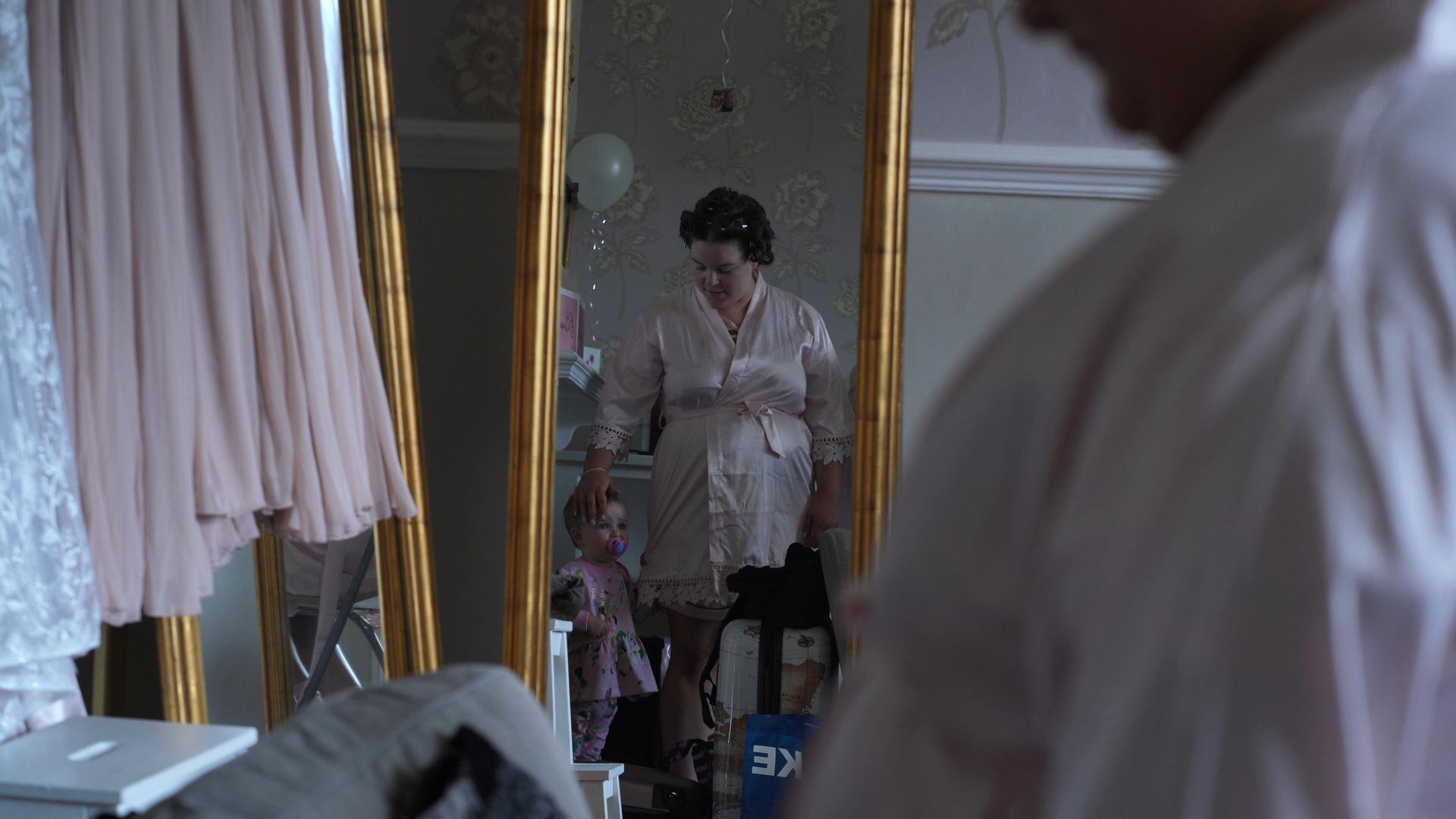 Rebecca and Nathan Ashfield House Wedding 1 bridesmaid and flower girl video still in mirror