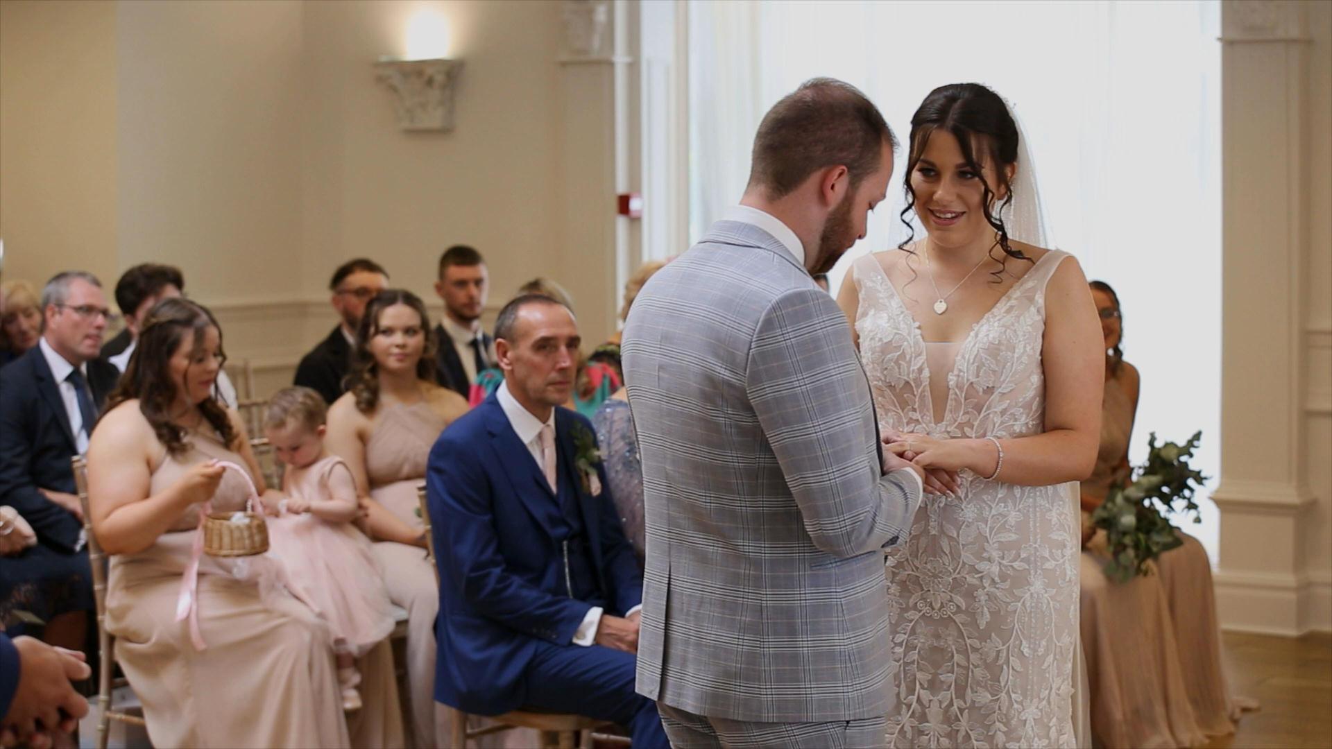 Rebecca and Nathan Ashfield House Wedding 12 couple exchange wedding rings during ceremony at Ashfield House