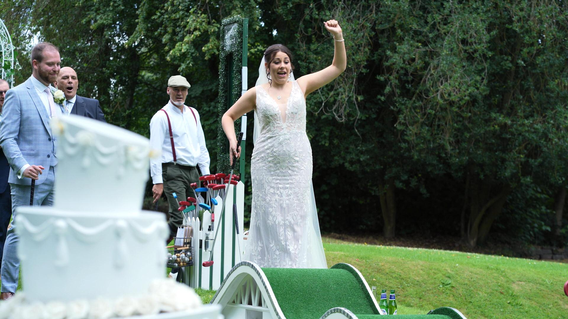 Rebecca and Nathan Ashfield House Wedding 17 bride celebrates a hole in one at Ashfield House