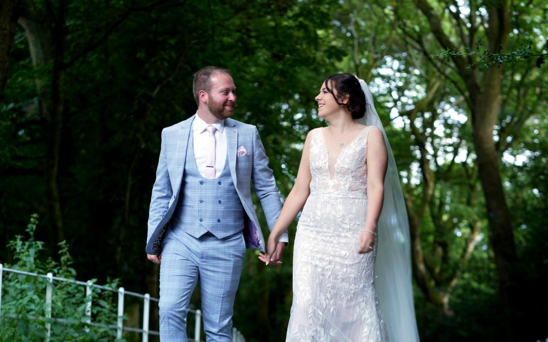 videographer films couple laughing and walking at Ashfield House