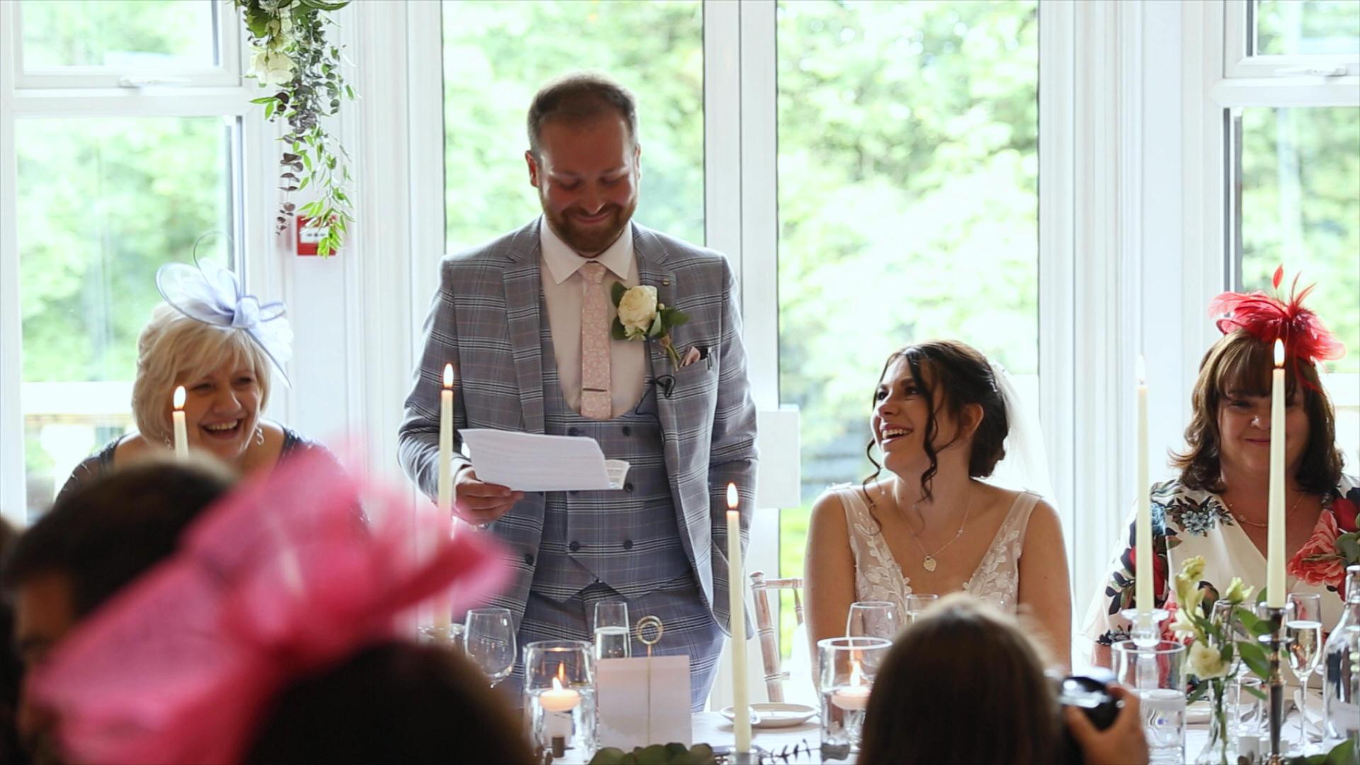 Rebecca and Nathan Ashfield House Wedding 26 video still of bride smiling during grooms speech