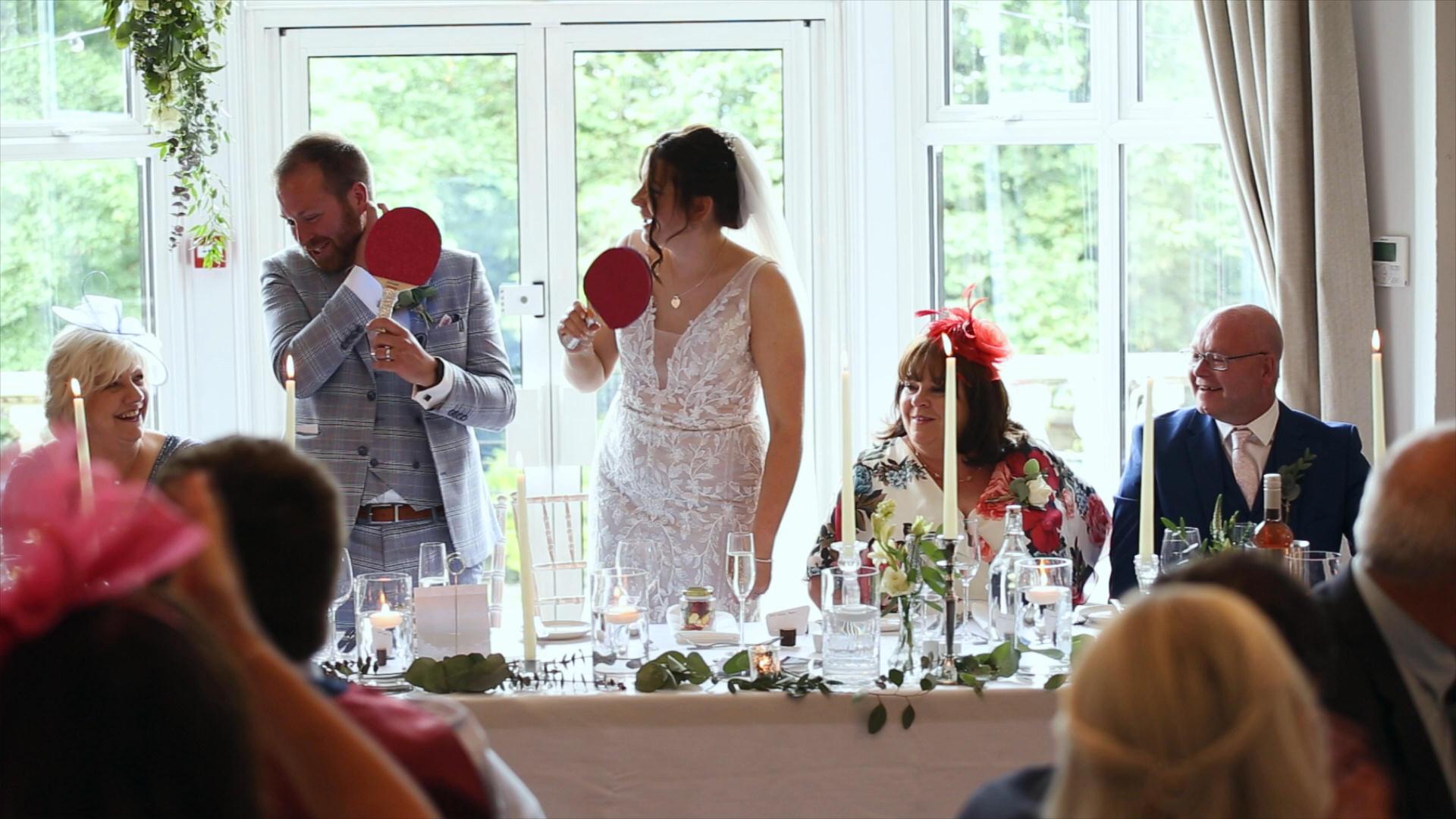 Rebecca and Nathan Ashfield House Wedding 28 couple play mr and mrs quiz during best men speech