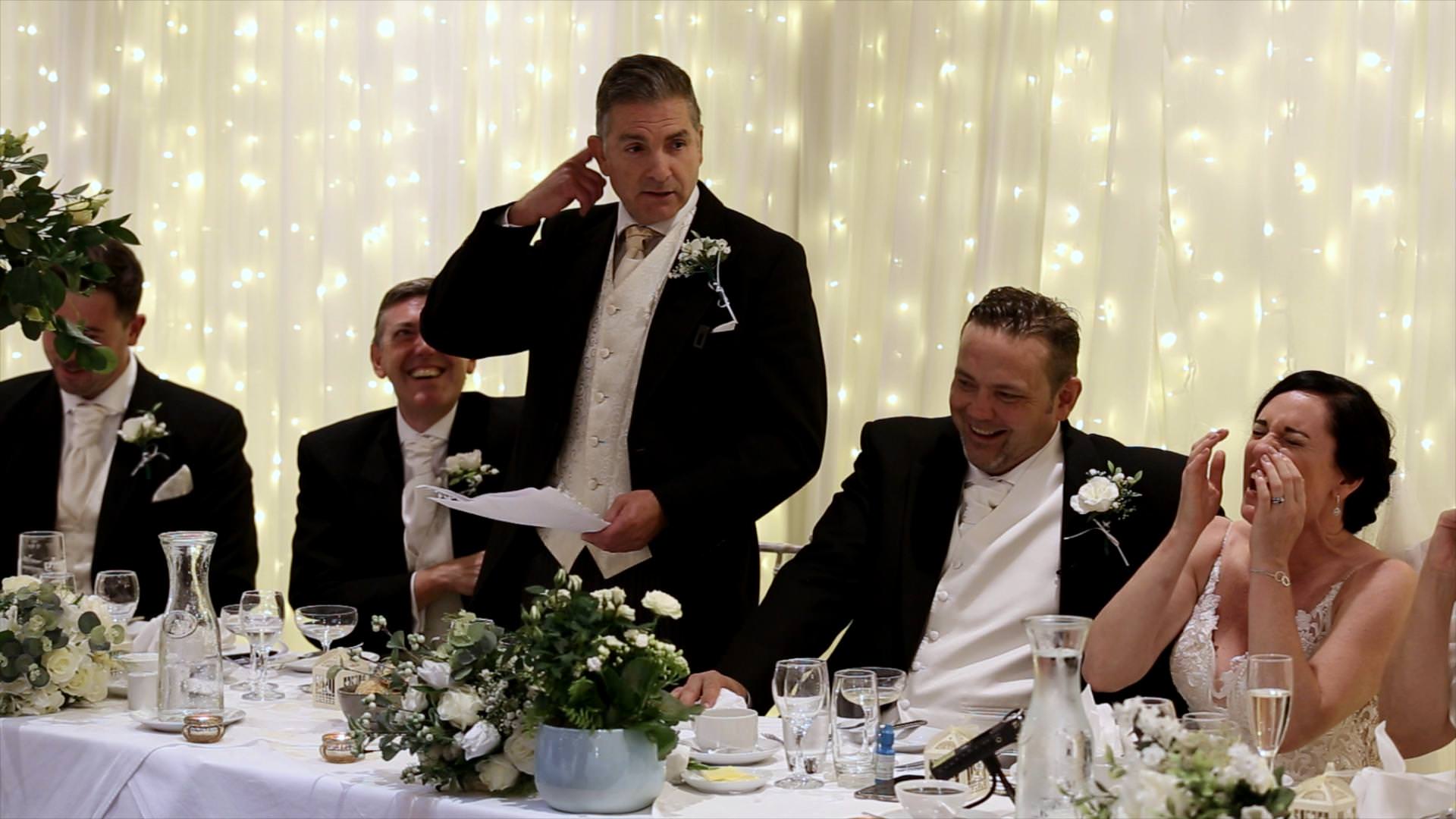 best man speech and laughing couple