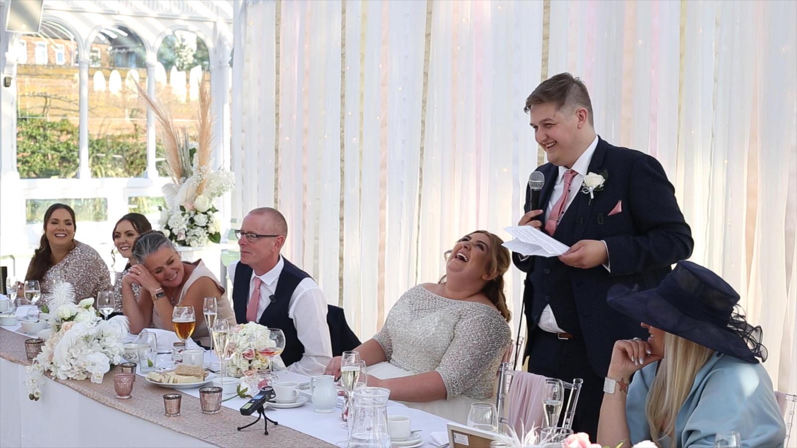 Groom makes bride belly laugh during wedding reception at Isla Gladstone