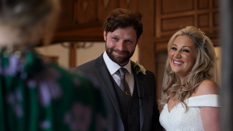 videographer films groom getting emotional during ceremony