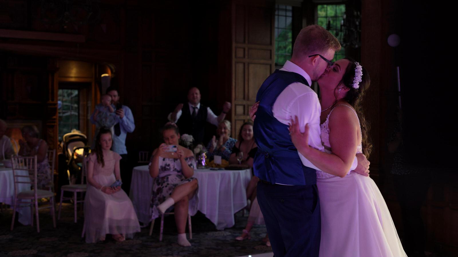 couple kiss during first dance at Inglewood Manor
