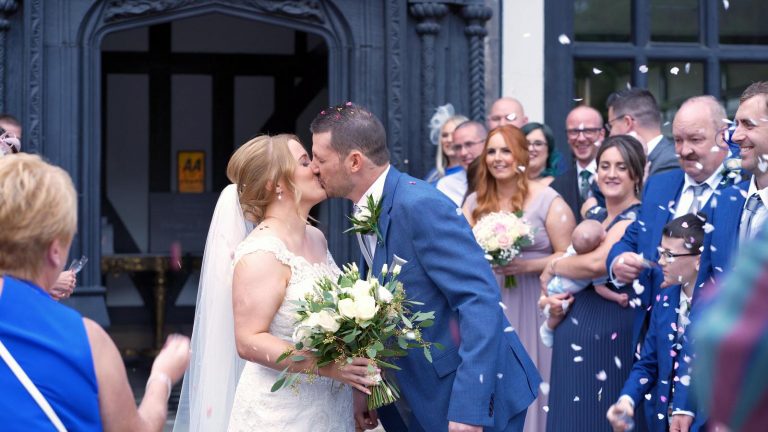 couple kiss during confetti photo and video outside Hillbark
