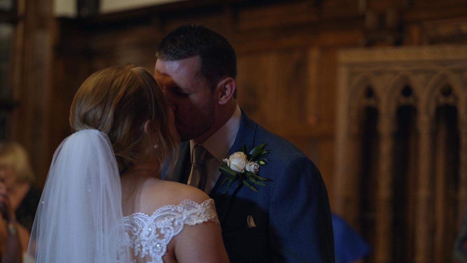 couple kiss during first dance at hillbark hotel