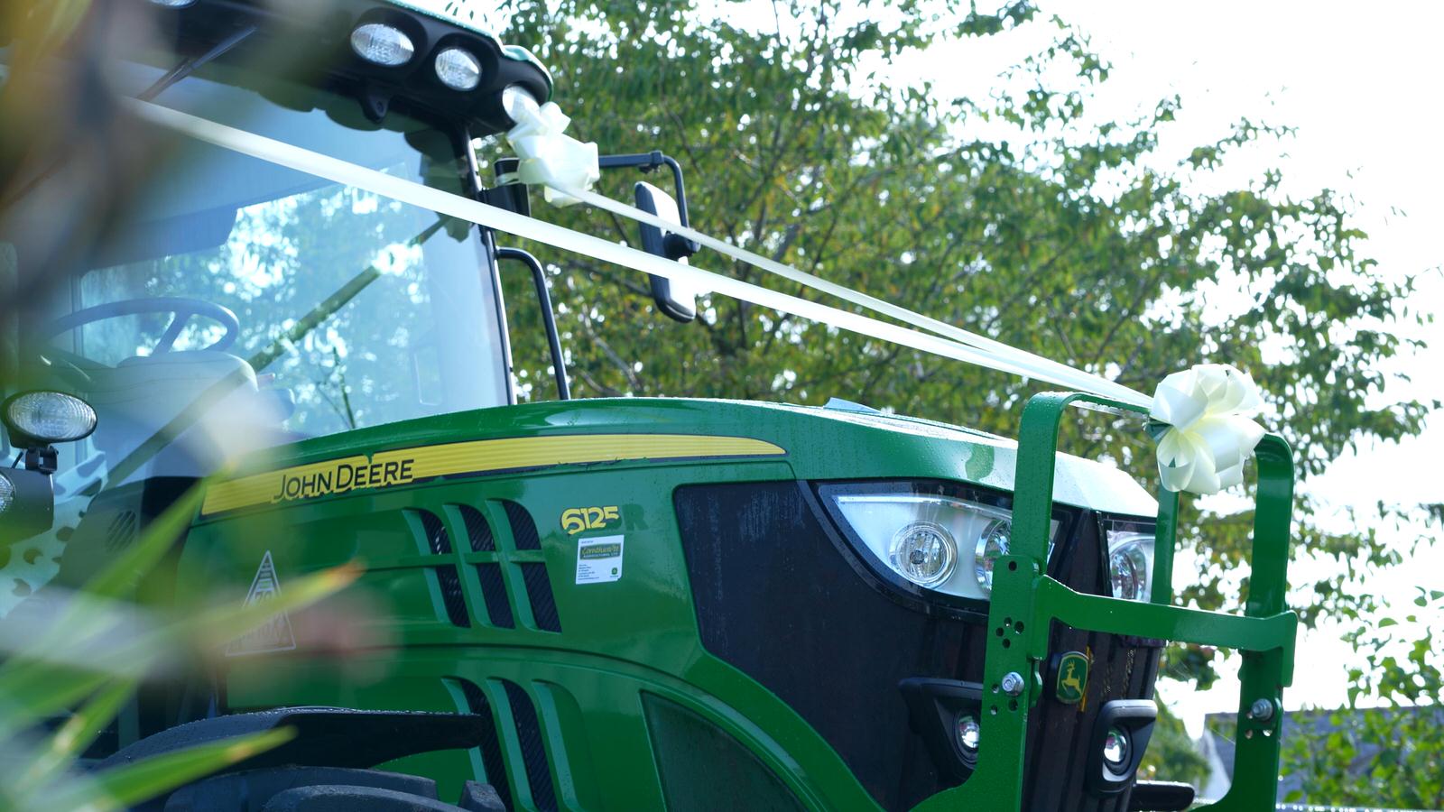 John Deere tractor with wedding ribbons on