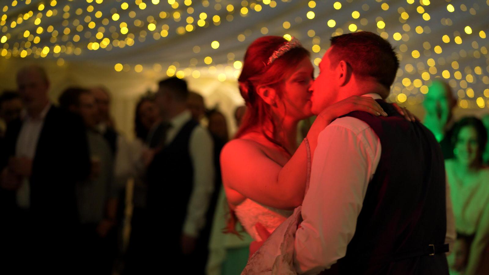 couple kiss on the dancefloor at Inn at whitewell