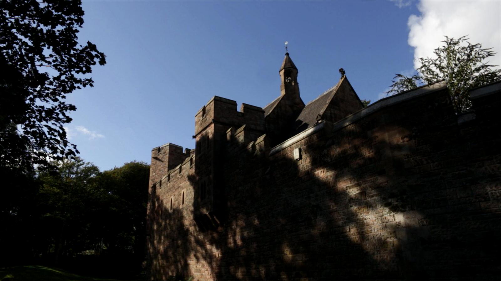 video still of peckforton castle in sunlight